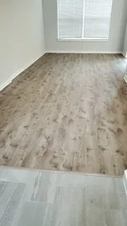 a view of wooden floor and cabinet