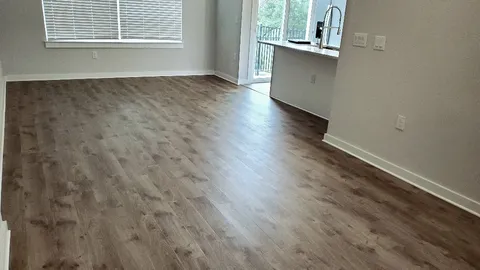 a view of a livingroom with wooden floor