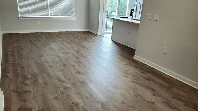 a view of a livingroom with wooden floor