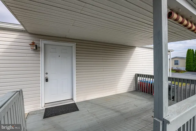 a view of a porch with wooden stairs