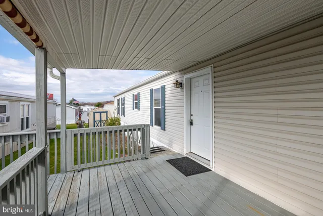 a view of a house with porch and wooden floor