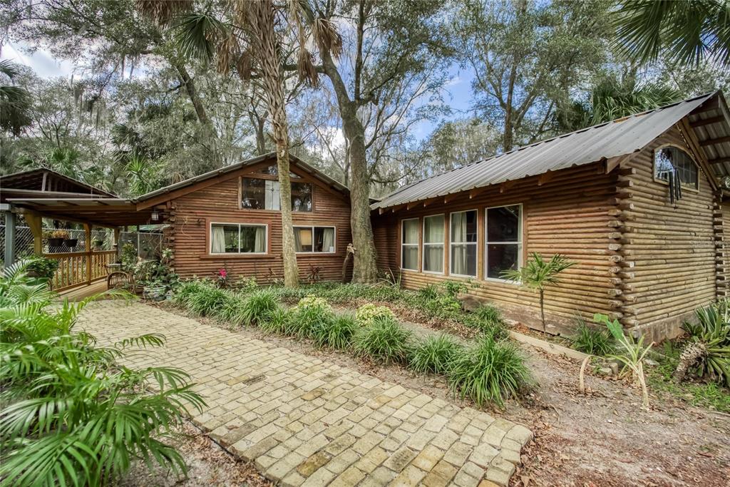 1625 East Keysville Road Lithia, FL 33547 - Photo 1 of 1 a front view of a house with garden