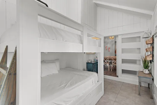 a bedroom with a bed and a chair