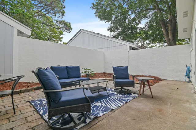 a couple of chairs sitting in backyard of a house