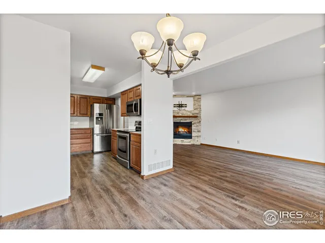 a view interior of kitchen and dining room with wooden floor