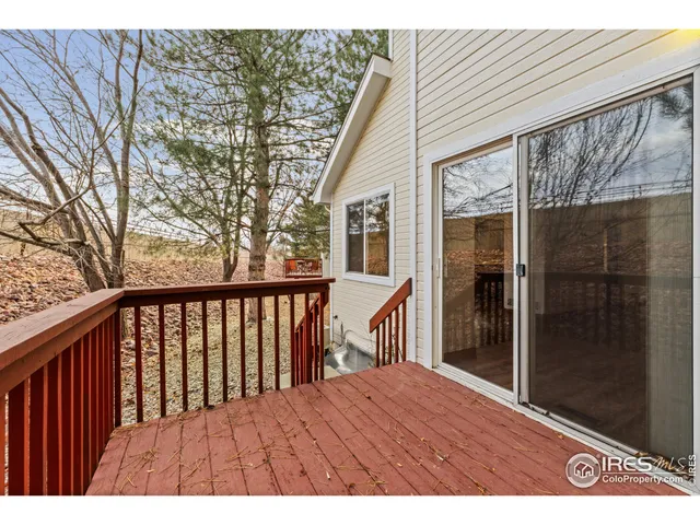 a view of balcony with wooden floor