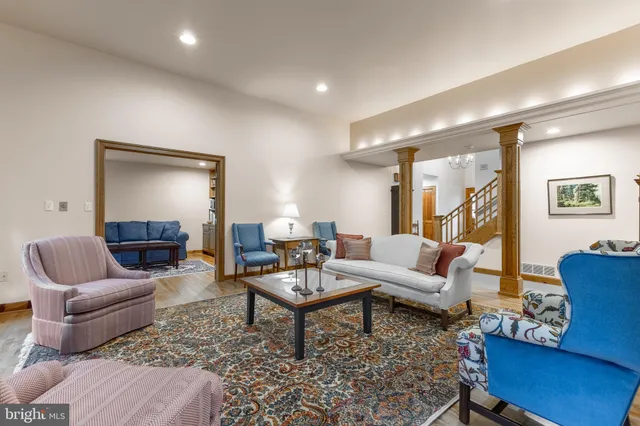 a living room with furniture and a rug