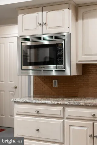 a utility room with sink dryer and washer