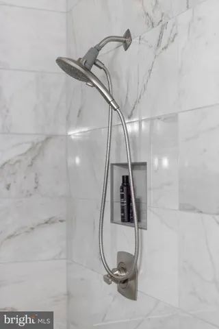 a bathroom with a sink vanity and a mirror