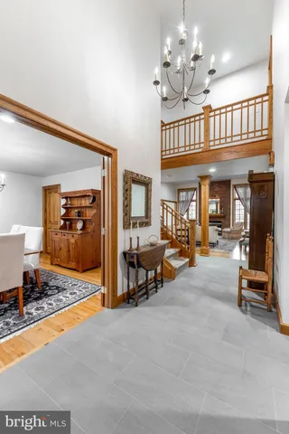 a view of a livingroom with furniture and a chandelier