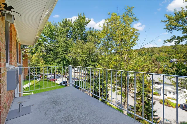 a view of a chair and table in the balcony