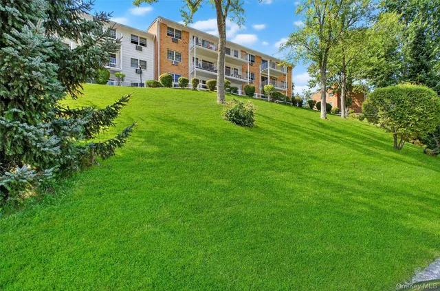 a view of a lake with a table and chairs