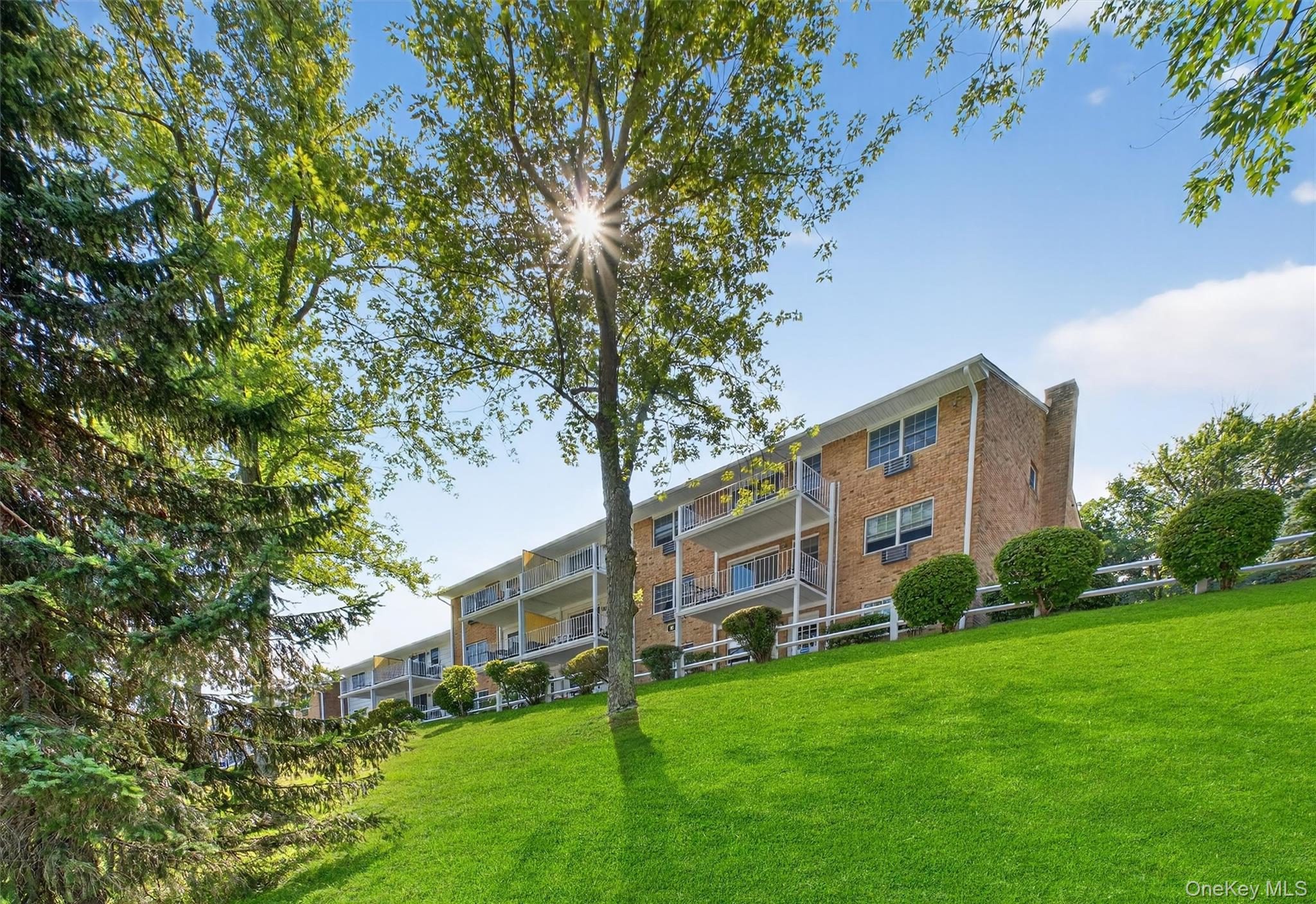 1840 Crompond Road, Unit 5C8 Peekskill, NY 10566 - Photo 31 of 36 a view of a house with a yard