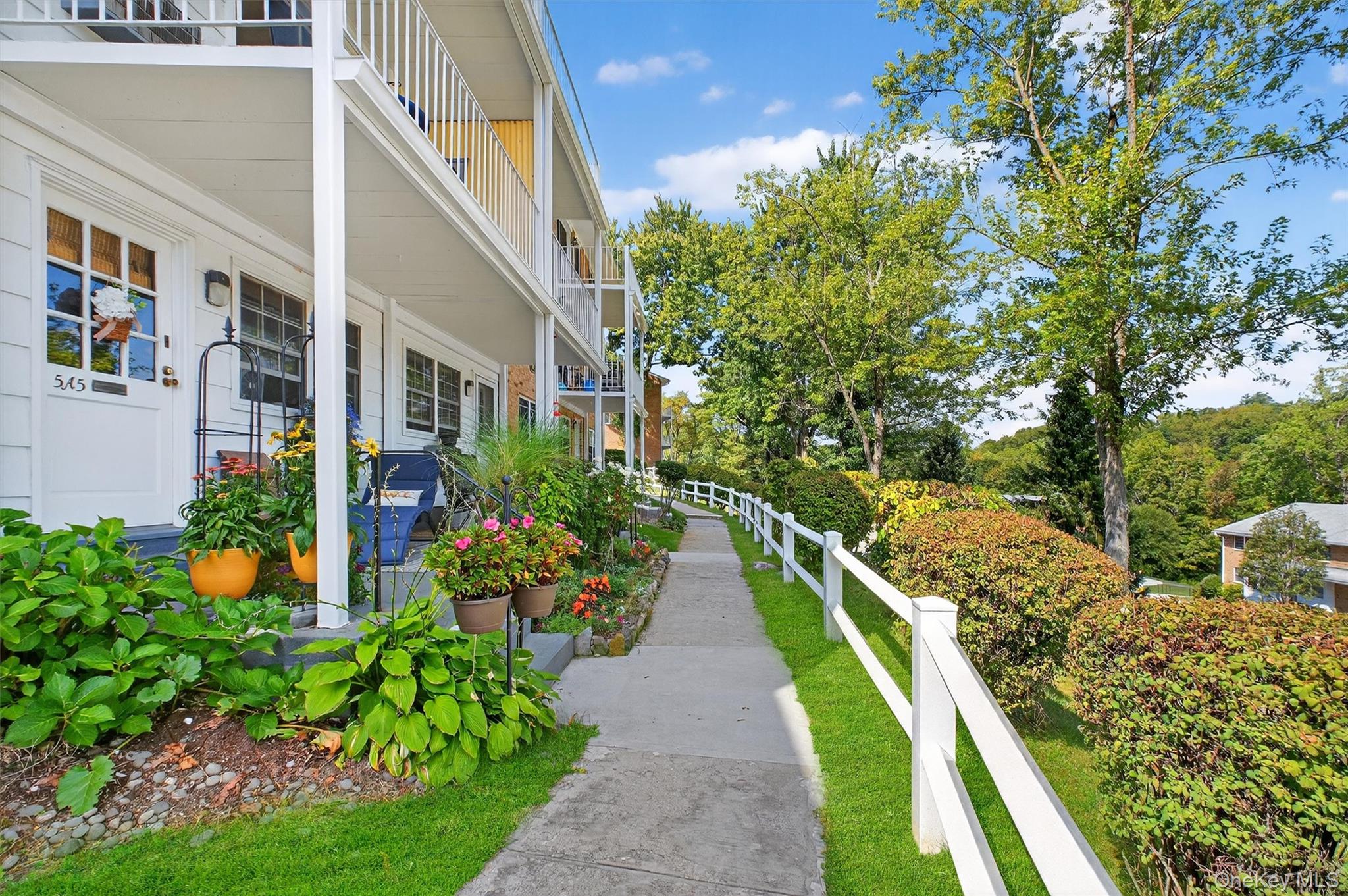 1840 Crompond Road, Unit 5C8 Peekskill, NY 10566 - Photo 6 of 36 a view of an houses with backyard and garden