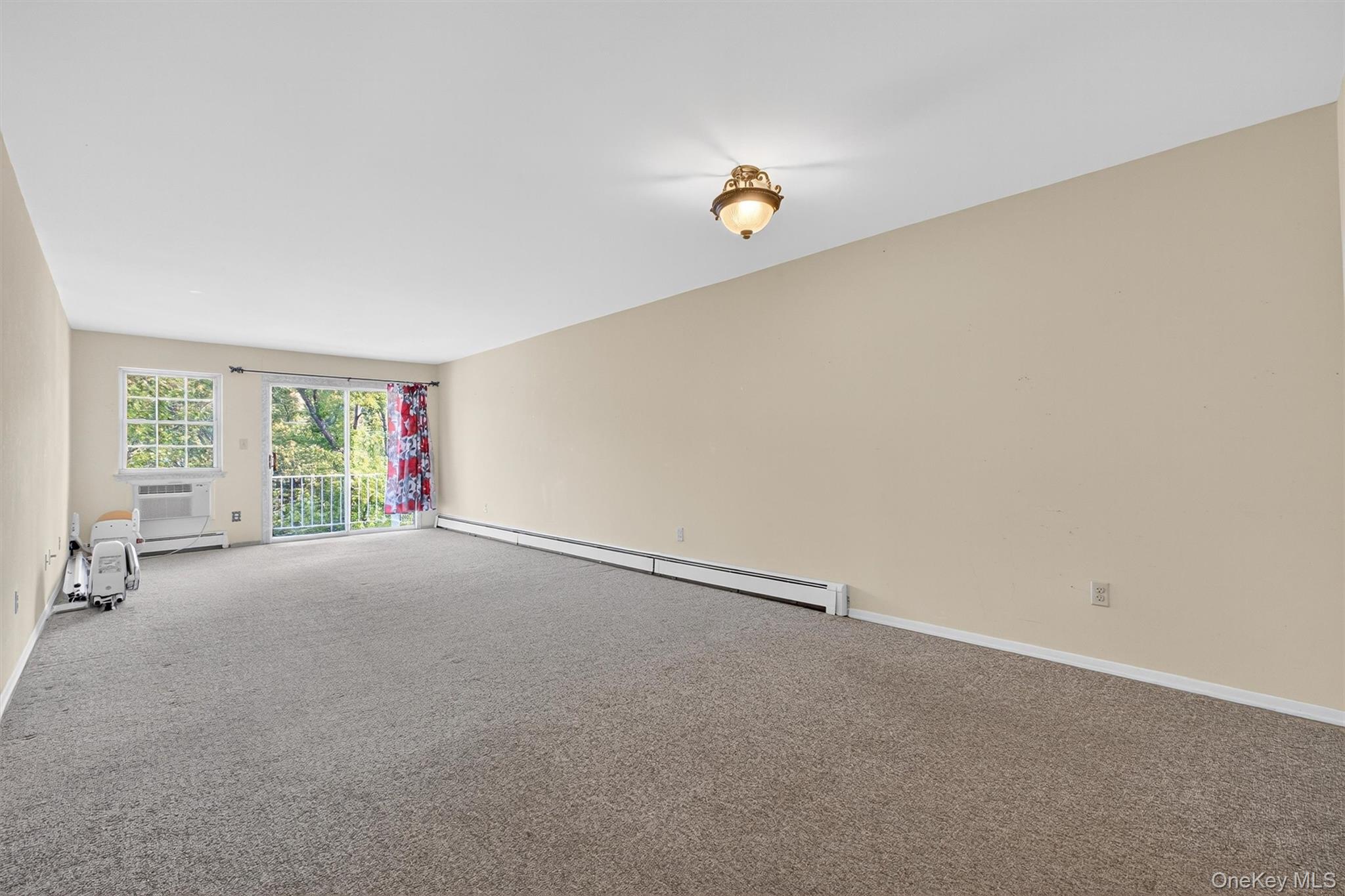 1840 Crompond Road, Unit 5C8 Peekskill, NY 10566 - Photo 9 of 36 a view of an empty room with a window