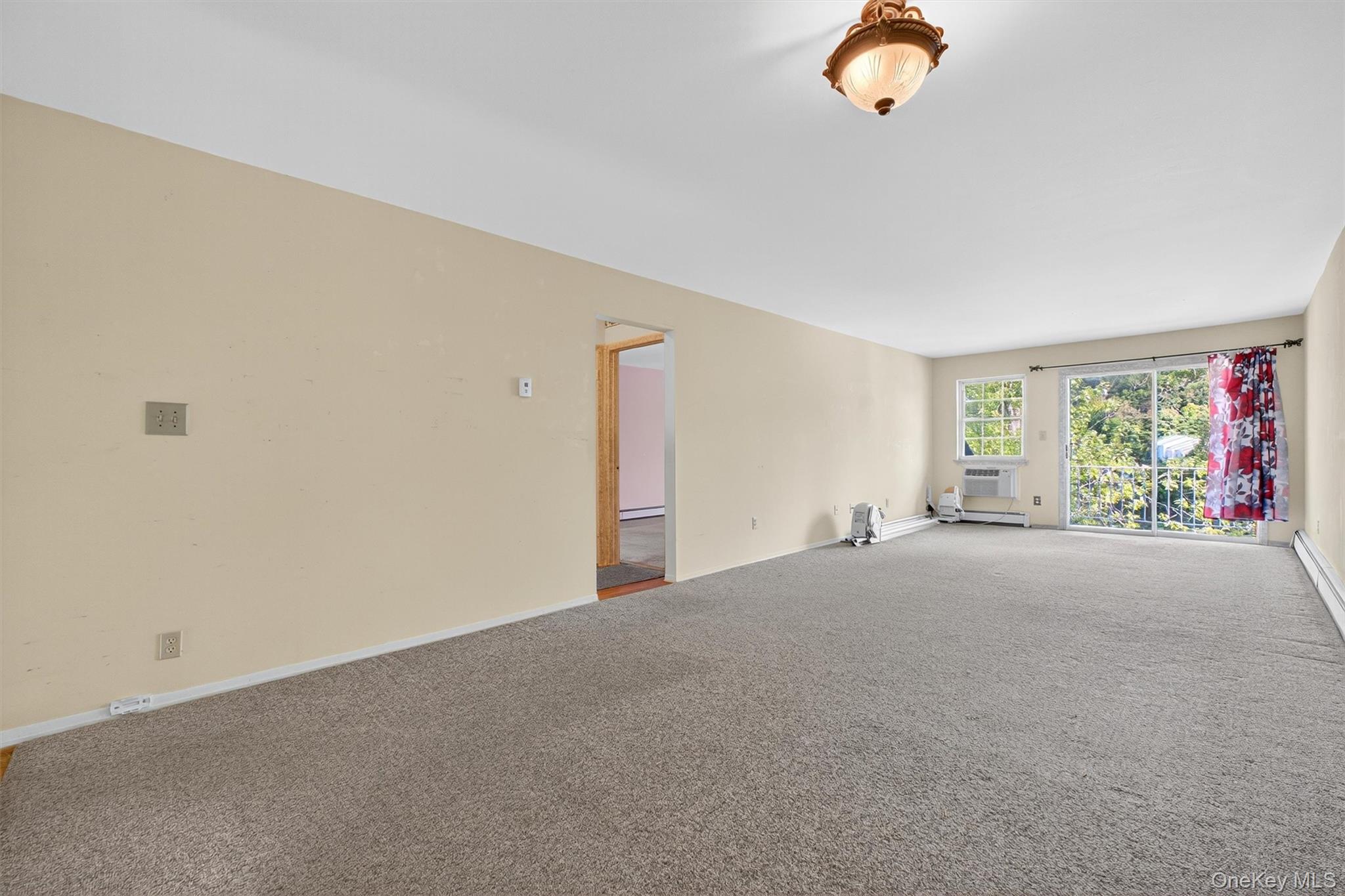 1840 Crompond Road, Unit 5C8 Peekskill, NY 10566 - Photo 10 of 36 a view of an empty room with a window