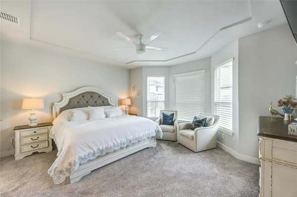 a bedroom with bed and window