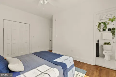 a bedroom with a bed and a couch