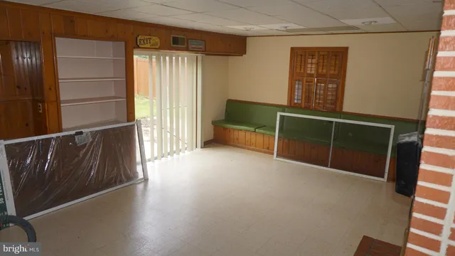 a white toilet sitting next to a bath tub