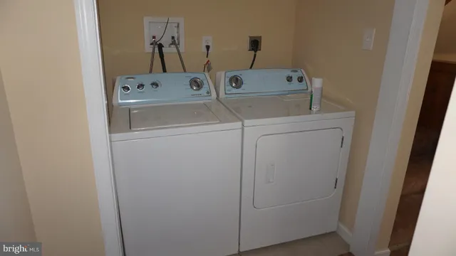 a bathroom with a sink a toilet and bathtub