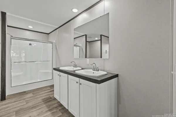 a bathroom with a sink and mirror