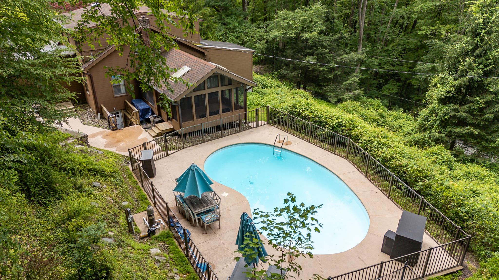 32 New Hill Road Putnam Valley, NY 10579 - Photo 1 of 1 an aerial view of a house with swimming pool and trees