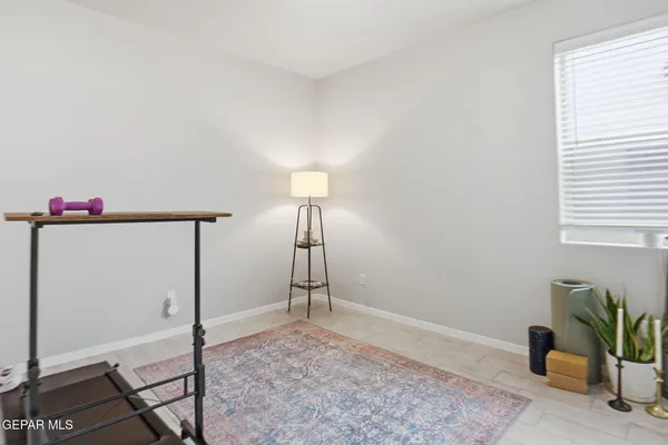 a bedroom with bed and a chandelier