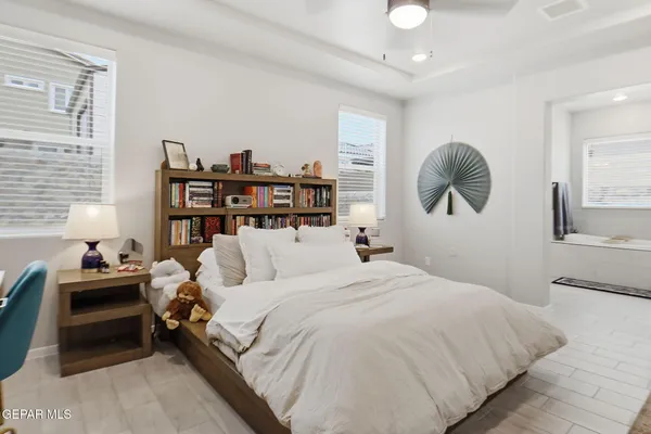 a bedroom with a bed and a bookshelf