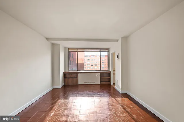 a hallway with a white walls and white walls