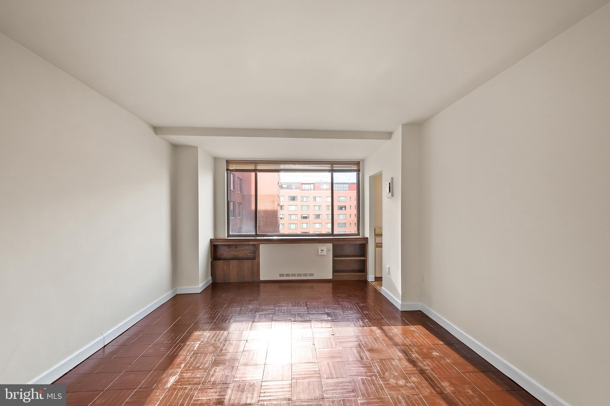 1111 Arlington Boulevard, Unit 738 Arlington, VA 22209 - Photo 11 of 37 a hallway with a white walls and white walls