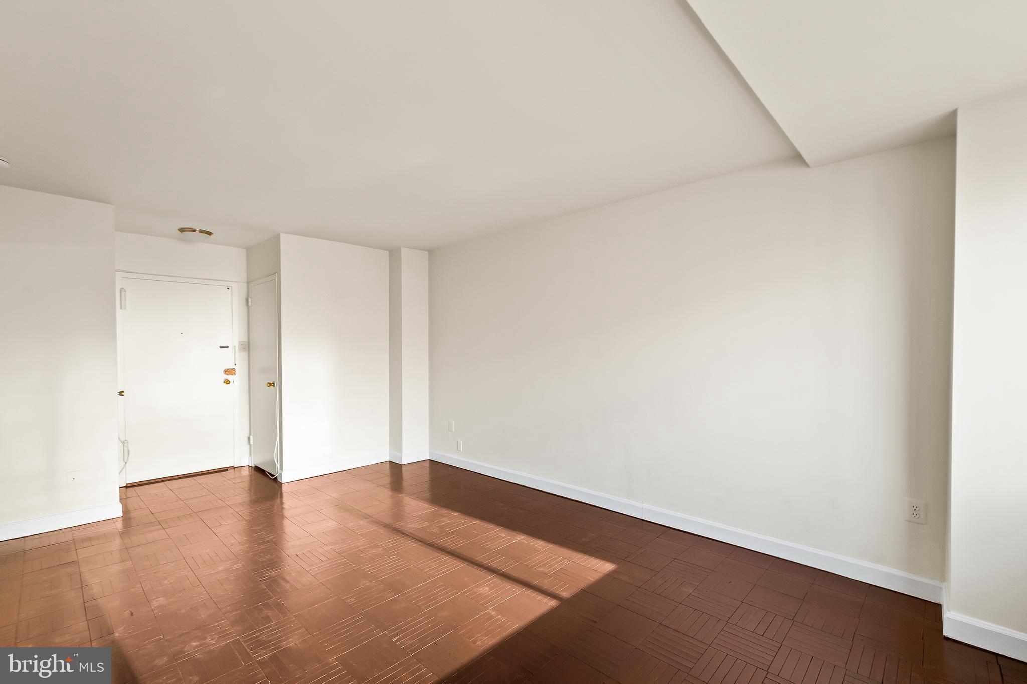 1111 Arlington Boulevard, Unit 738 Arlington, VA 22209 - Photo 13 of 37 an empty room with wooden floor