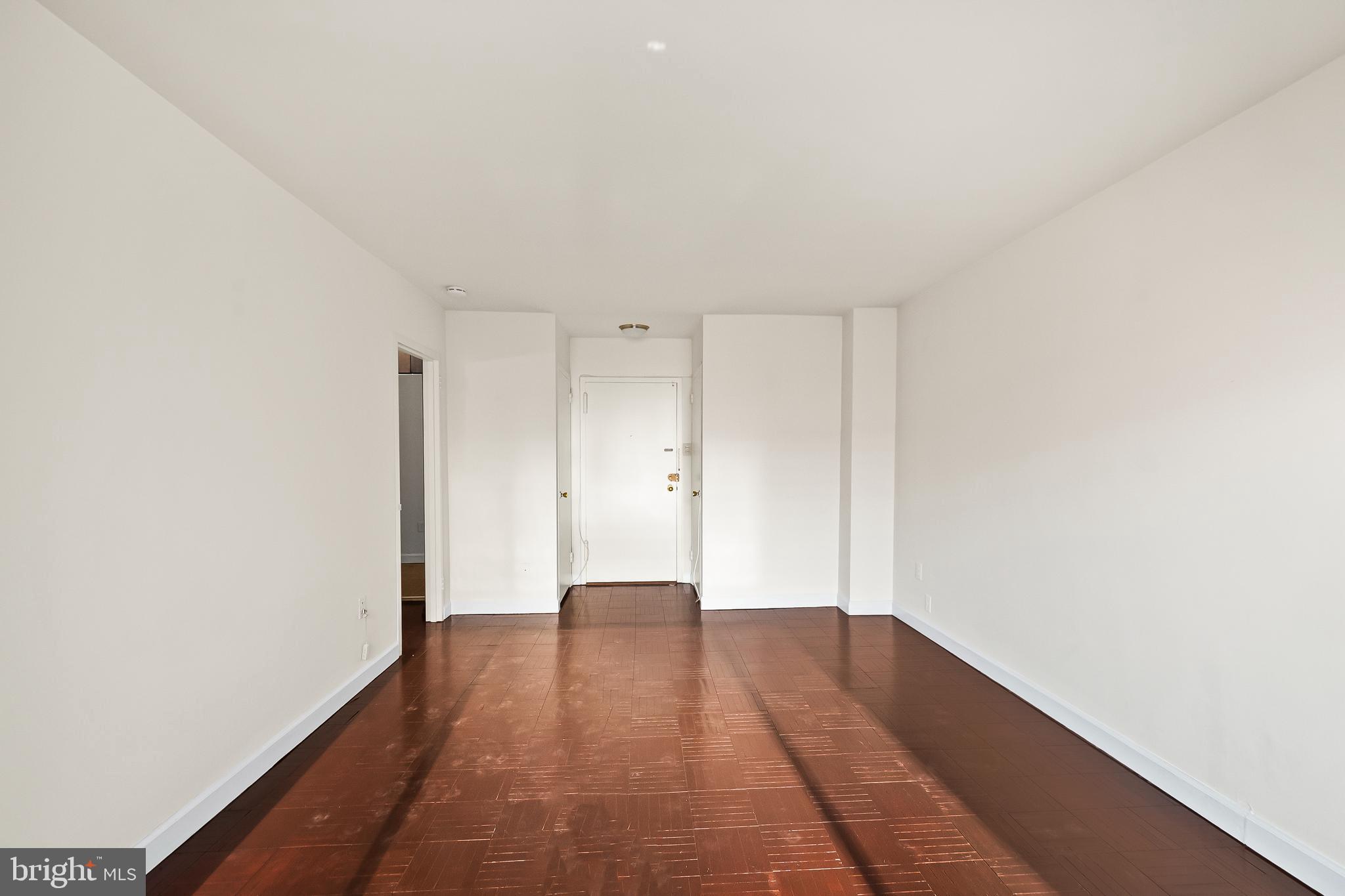 1111 Arlington Boulevard, Unit 738 Arlington, VA 22209 - Photo 14 of 37 a view of an empty room with wooden floor