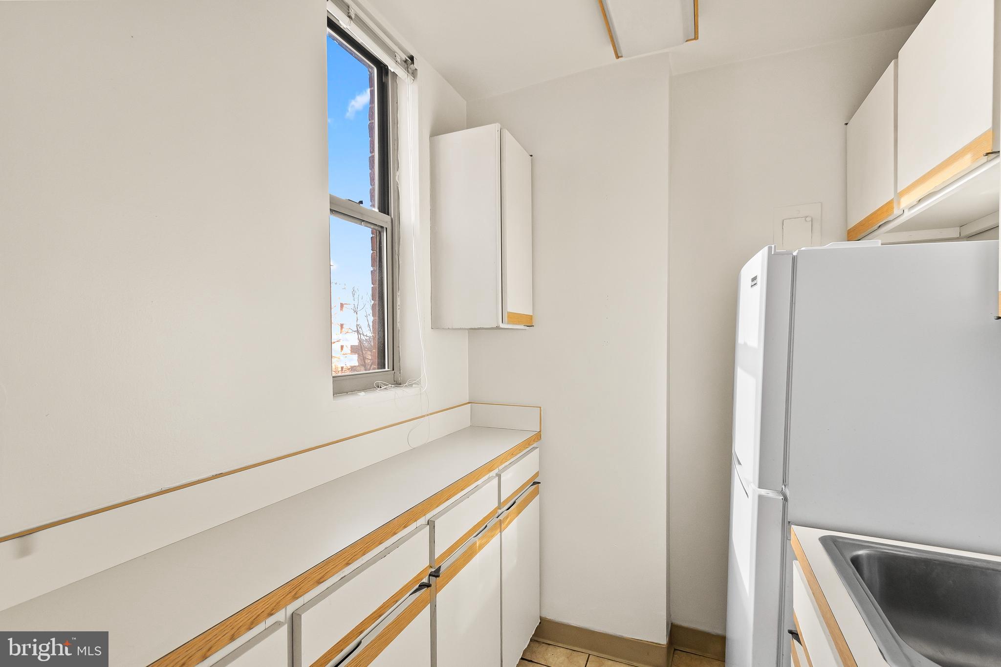1111 Arlington Boulevard, Unit 738 Arlington, VA 22209 - Photo 17 of 37 a utility room with window washer and dryer