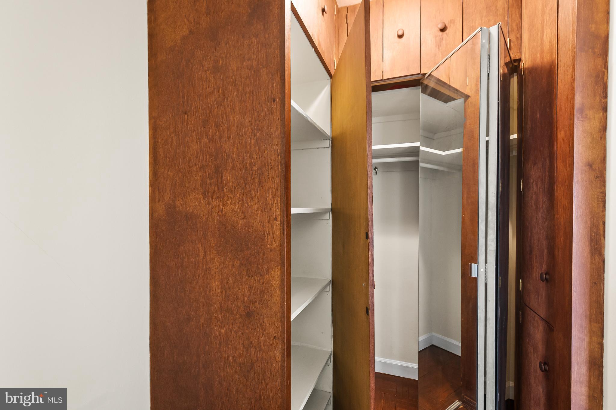 1111 Arlington Boulevard, Unit 738 Arlington, VA 22209 - Photo 19 of 37 a bathroom with a mirror and a glass shower door
