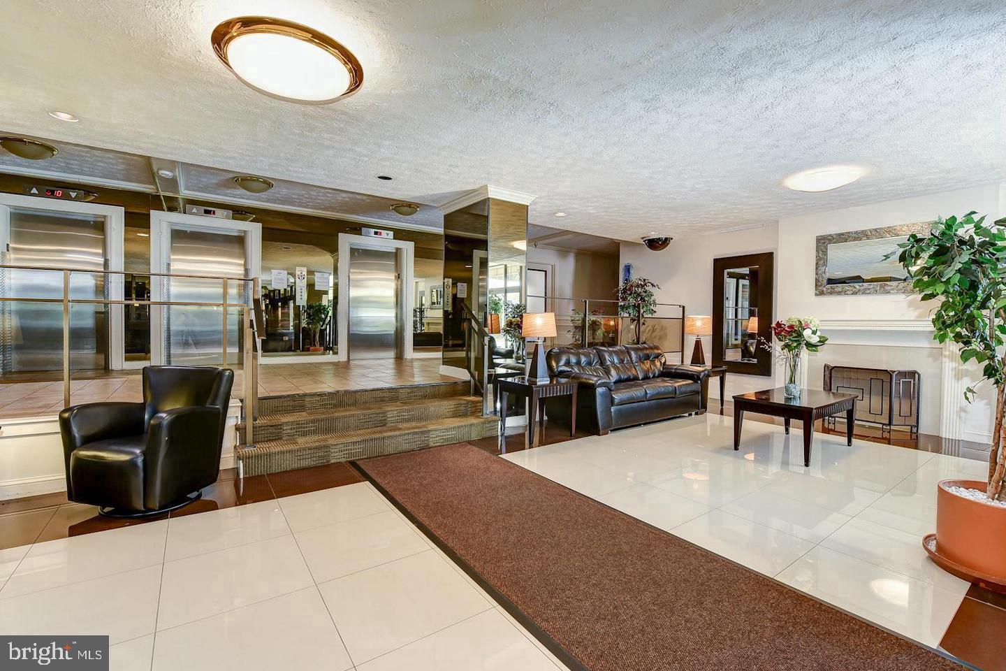 1111 Arlington Boulevard, Unit 738 Arlington, VA 22209 - Photo 4 of 37 a lobby with furniture and a large window