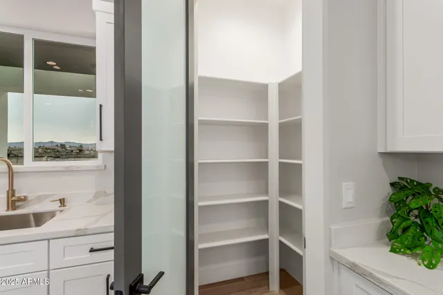 a kitchen with a refrigerator and a sink