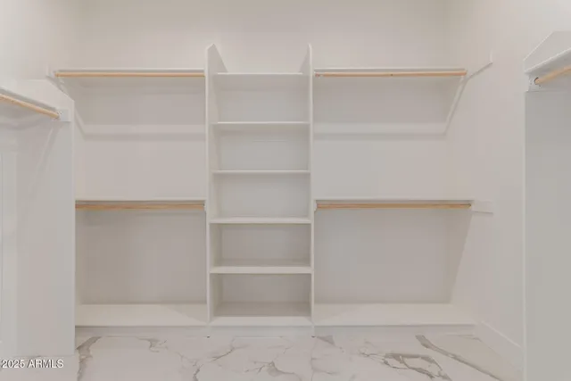 a view of an empty walk in closet