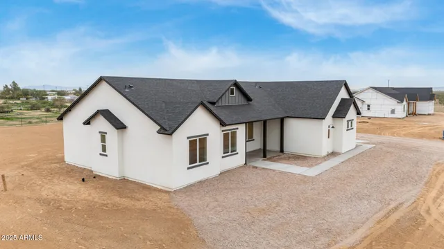an aerial view of houses with outdoor space