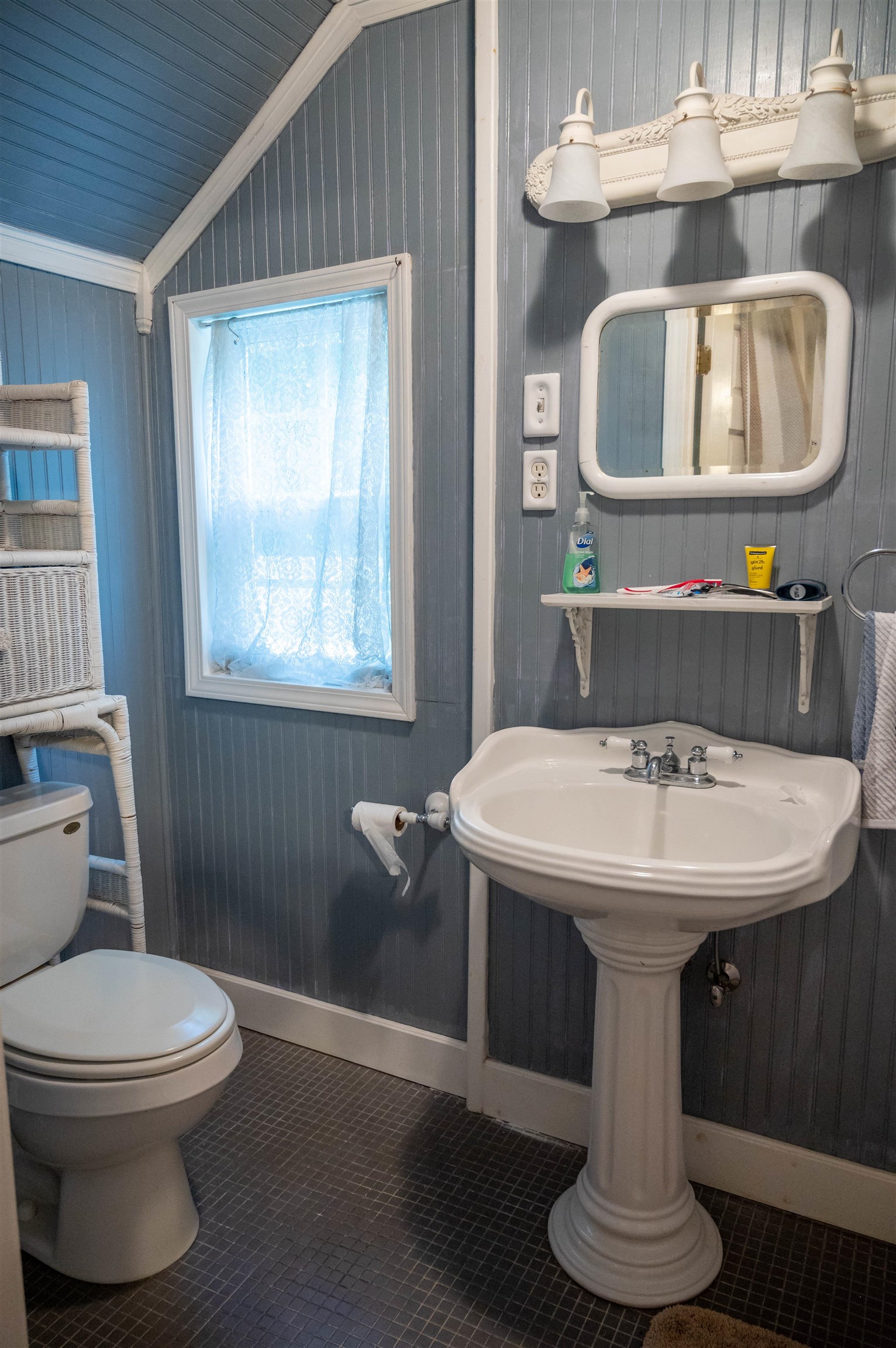 1267 Central Avenue Memphis, TN 38104 - Photo 22 of 25 a bathroom with a toilet sink and mirror