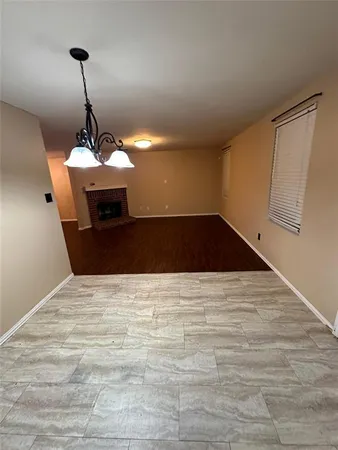 a view of a kitchen with a sink and cabinets