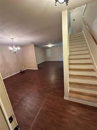 a view of a hallway with stairs