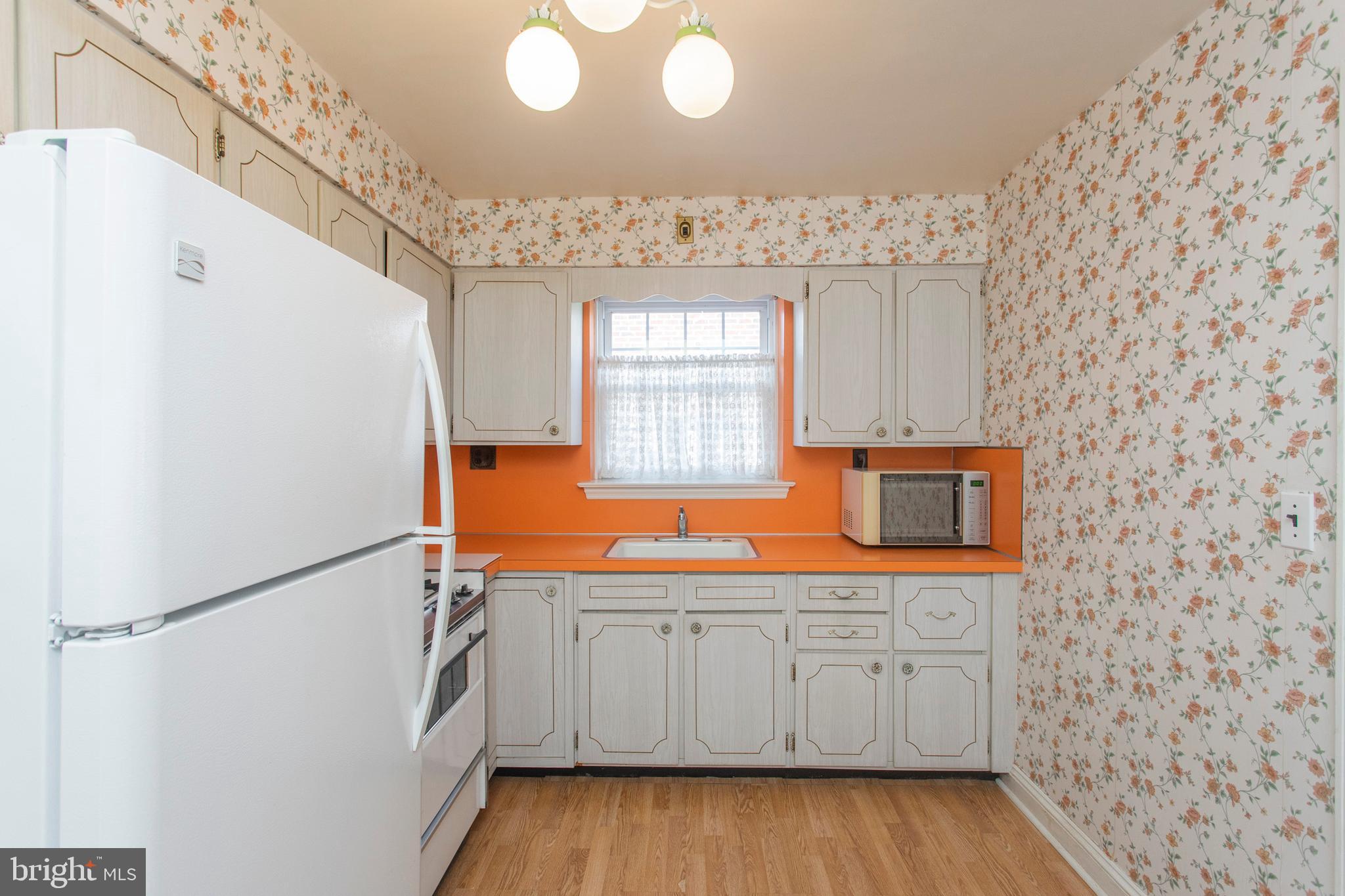 16 West Avenue Springfield, PA 19064 - Photo 18 of 34 a kitchen with stainless steel appliances a refrigerator and a sink