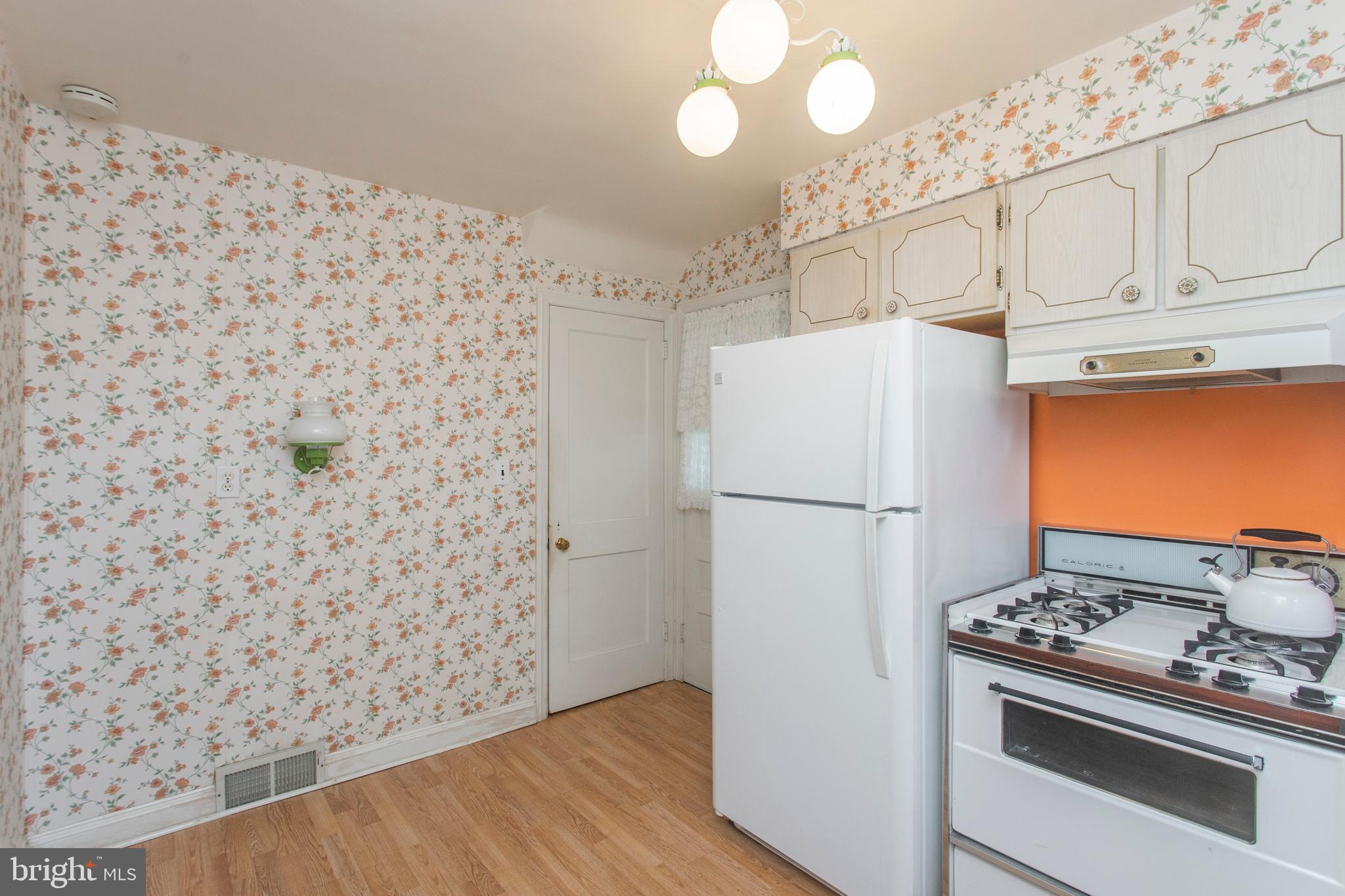16 West Avenue Springfield, PA 19064 - Photo 20 of 34 a white refrigerator freezer and a stove