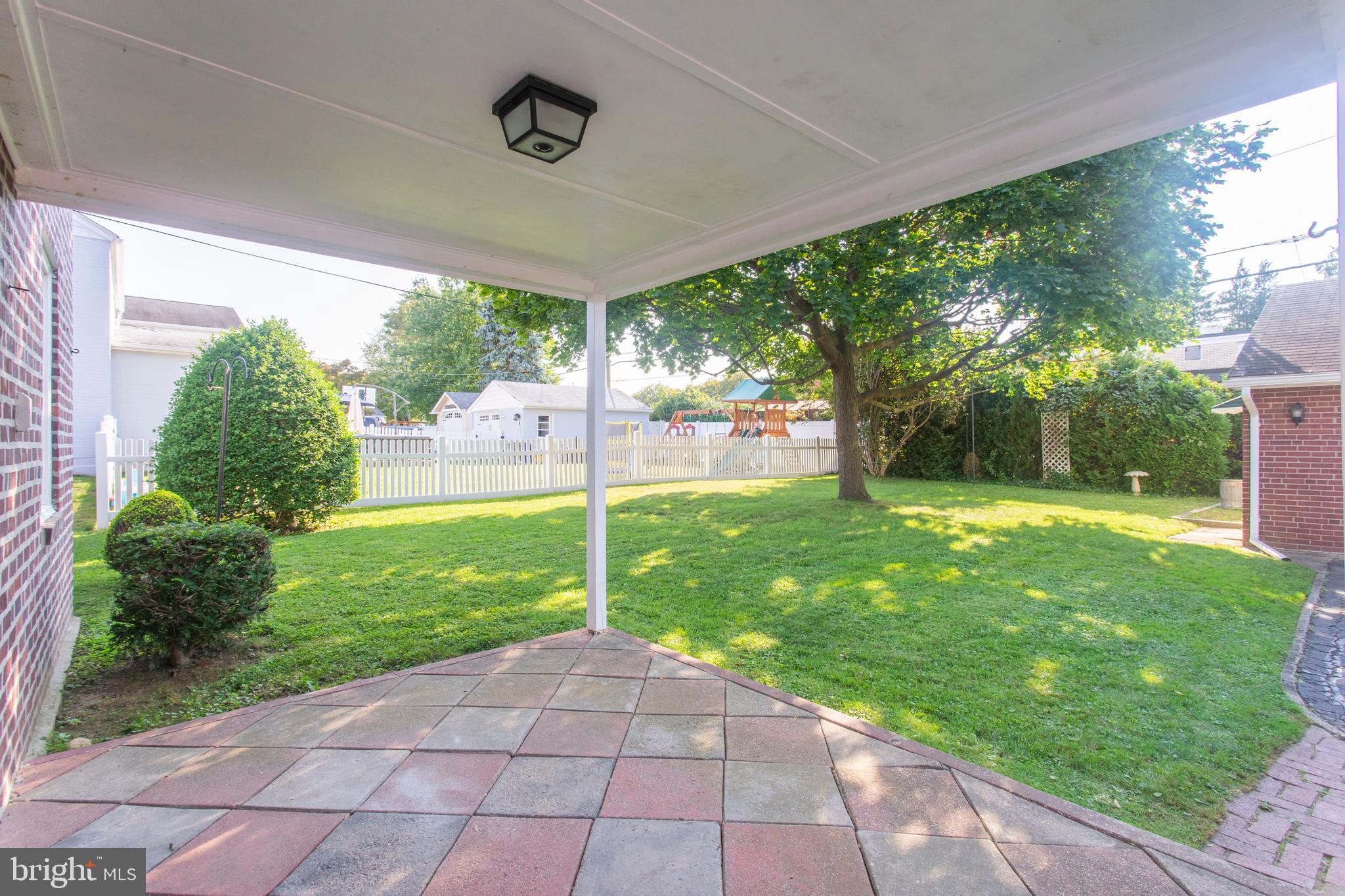 16 West Avenue Springfield, PA 19064 - Photo 3 of 34 a view of a porch with a backyard