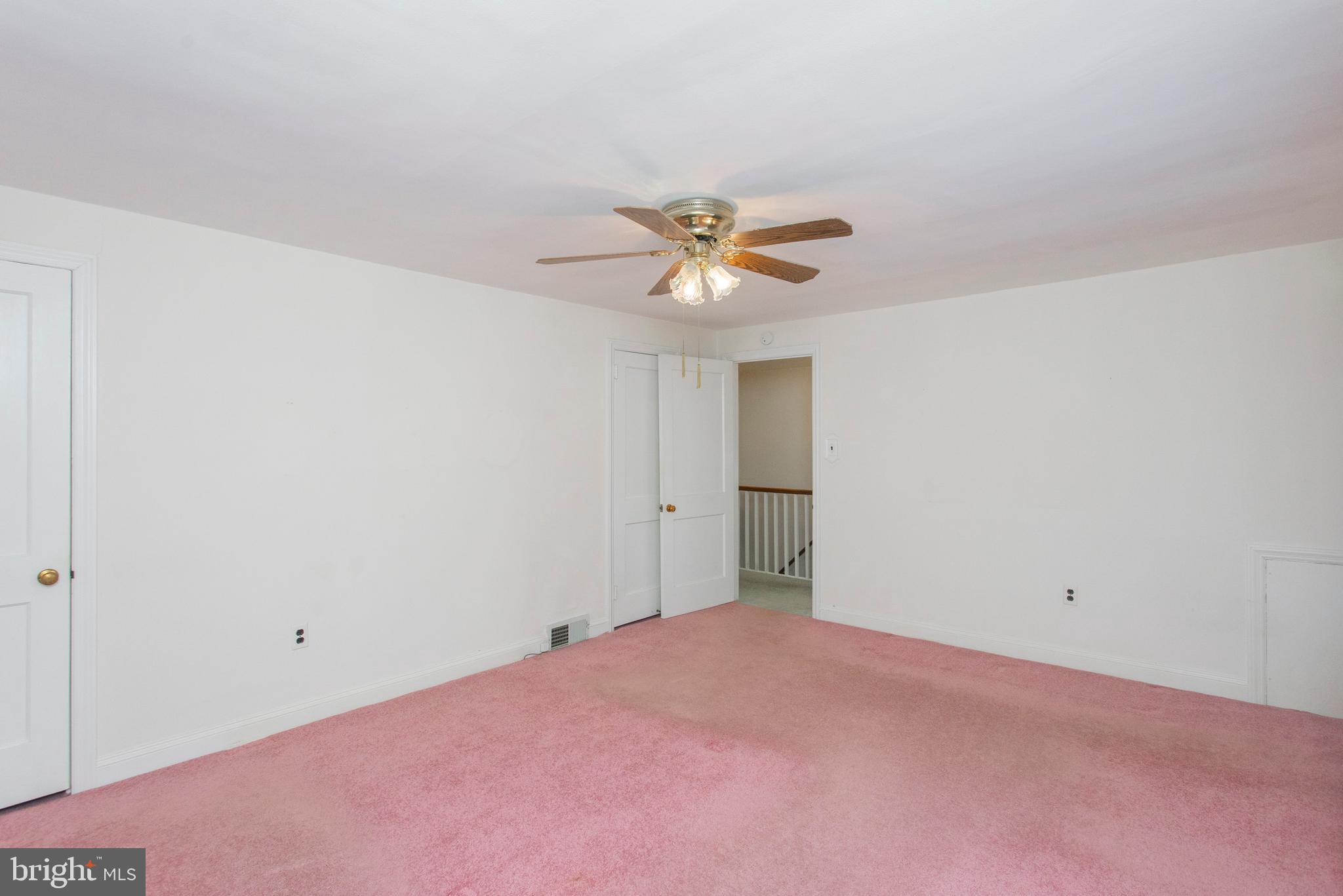 16 West Avenue Springfield, PA 19064 - Photo 25 of 34 a view of a big room with a ceiling fan and a window