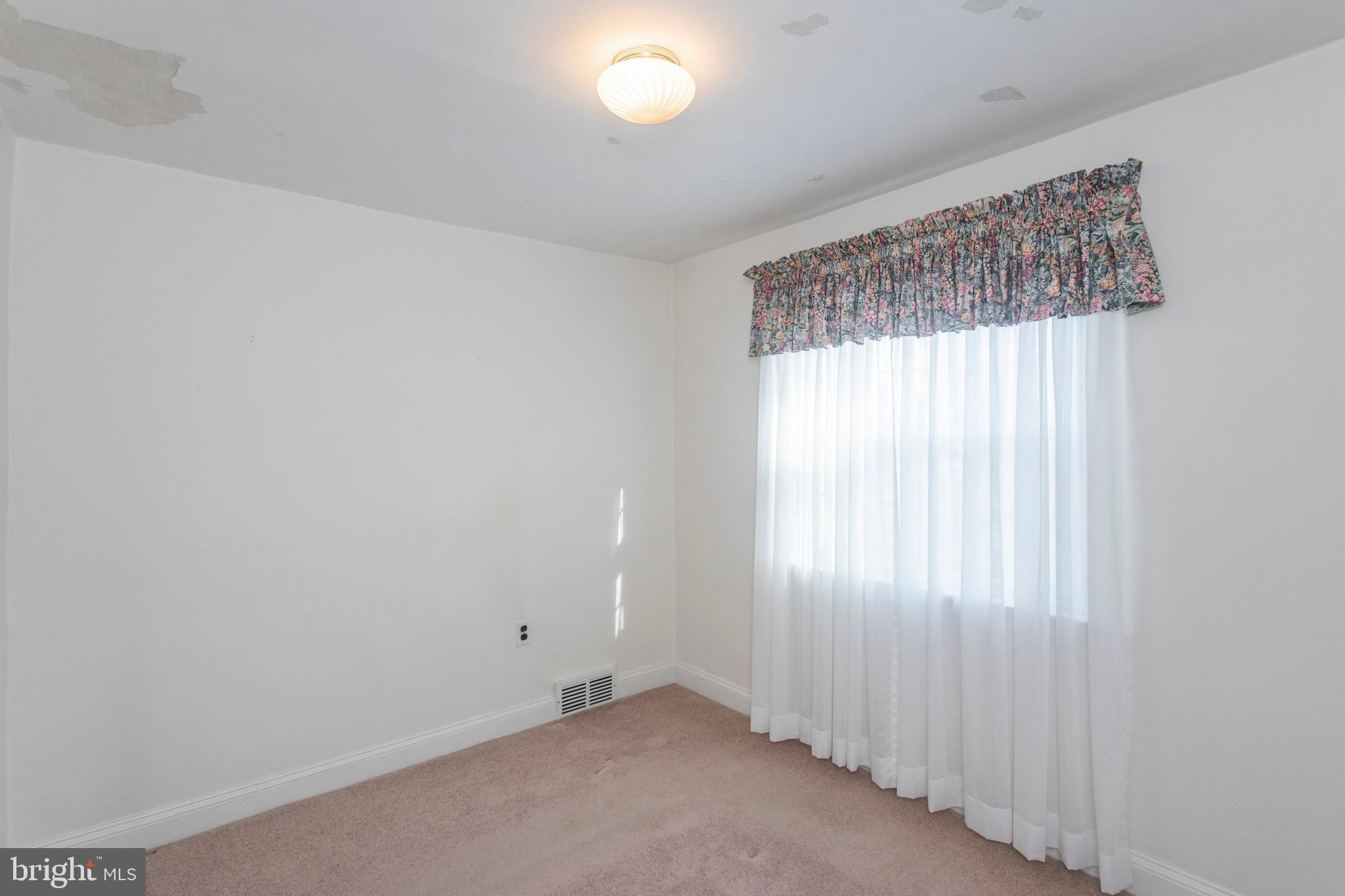 16 West Avenue Springfield, PA 19064 - Photo 30 of 34 a view of an empty room with a window