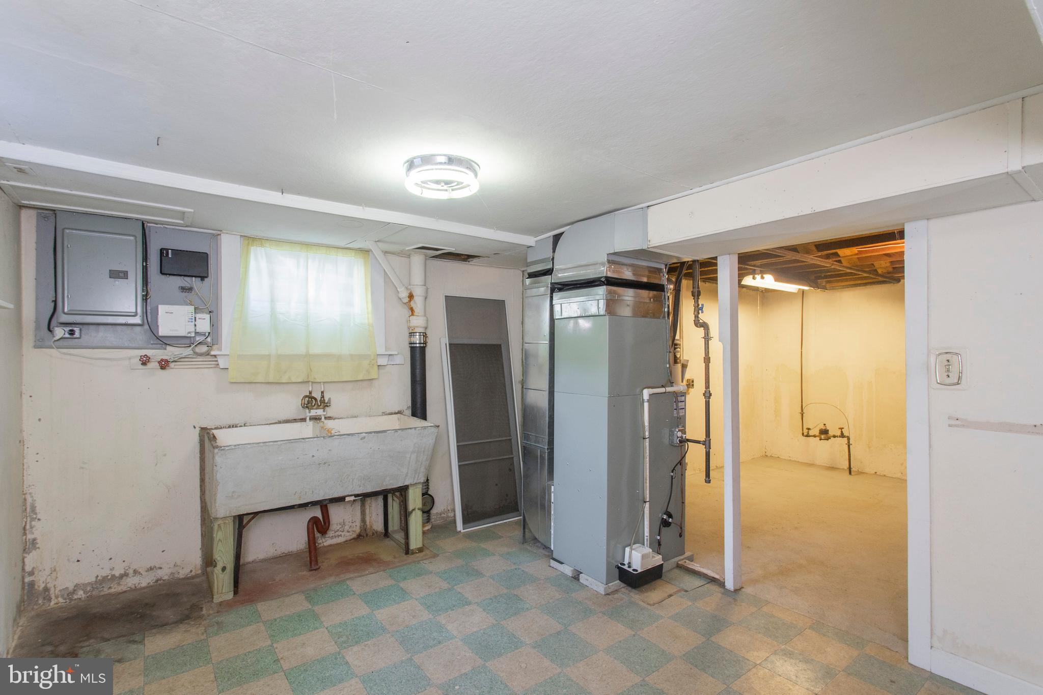 16 West Avenue Springfield, PA 19064 - Photo 32 of 34 a view of a bathroom with sink mirror and window