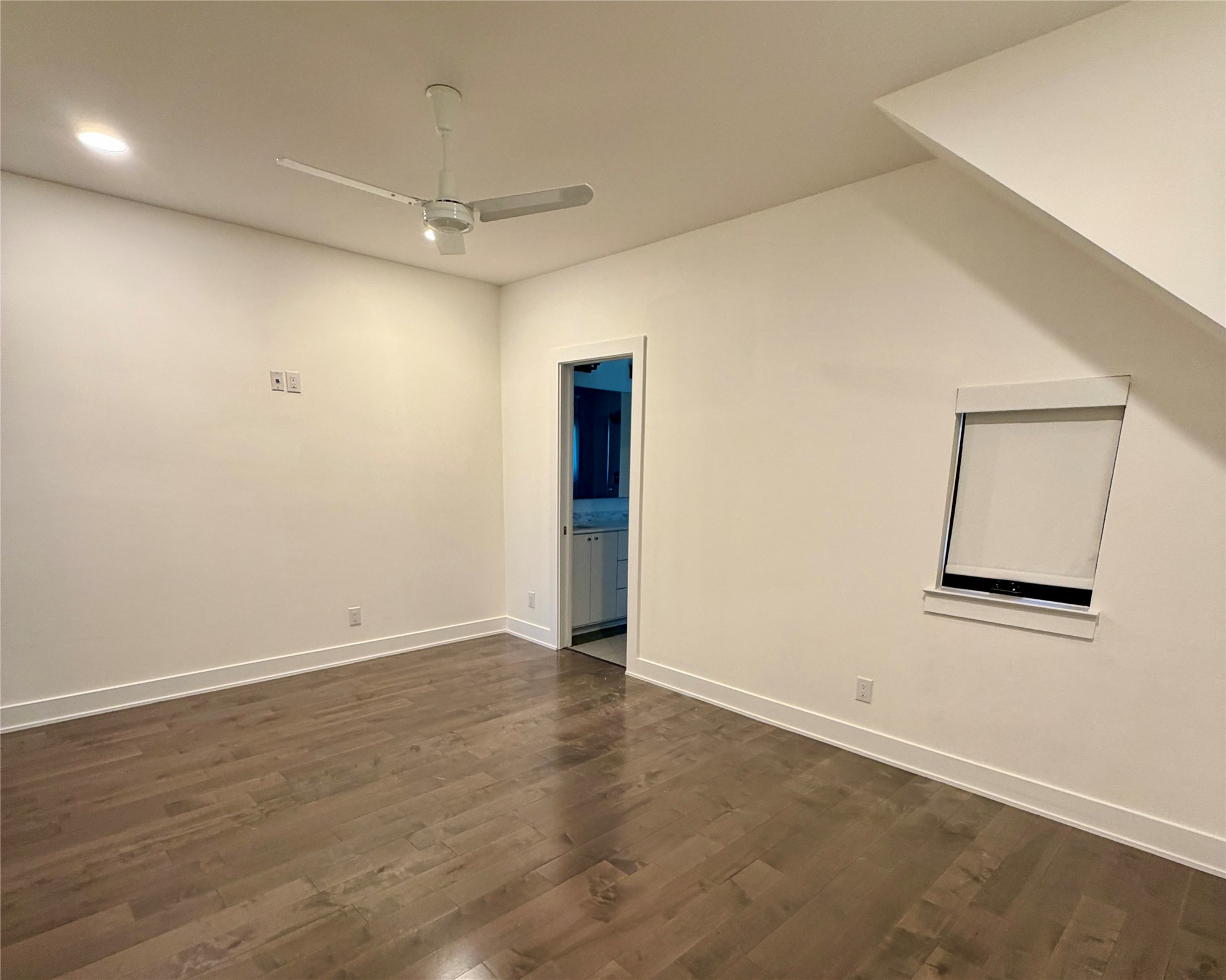 1515 Hether Street, Unit B Austin, TX 78704 - Photo 25 of 30 Hardwood floors and a sloped ceiling create a cozy and inviting bedroom retreat.