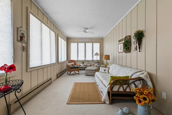a bed room with furniture and a window