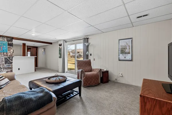 a living room with furniture and a window